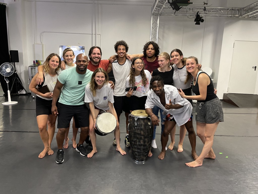 Group photo of people in a dance studio